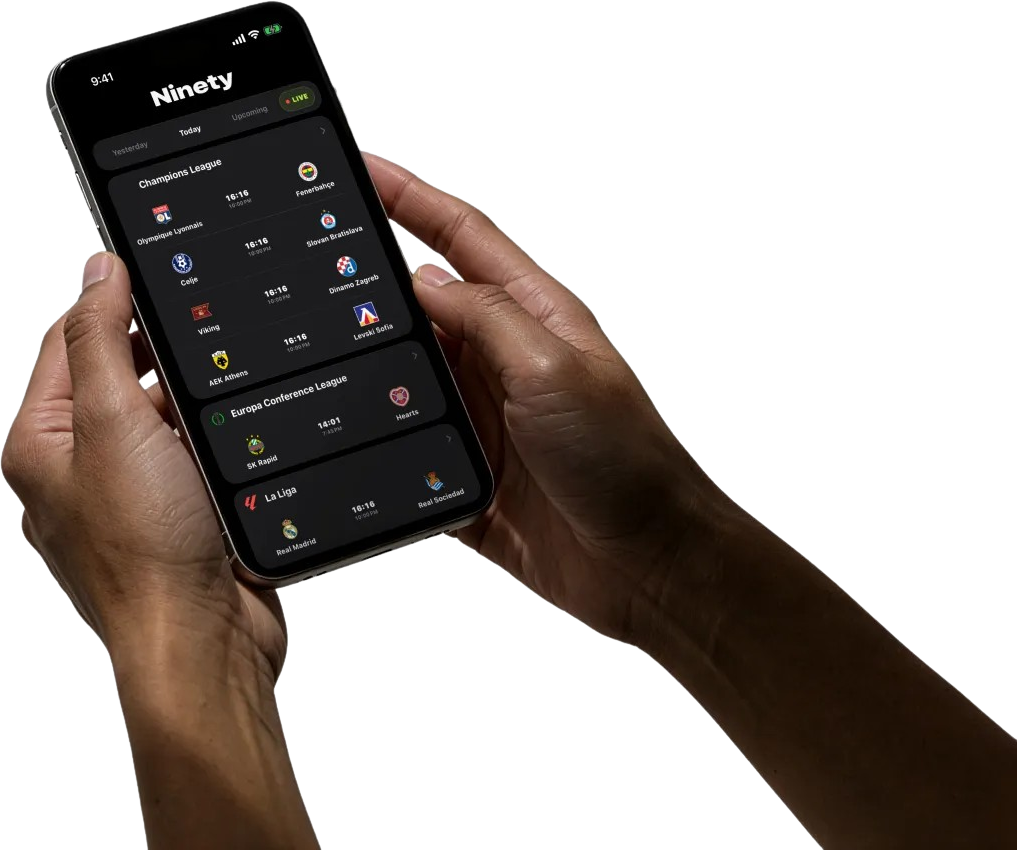 Two hands holding an iPhone with Ninety's real match feed open